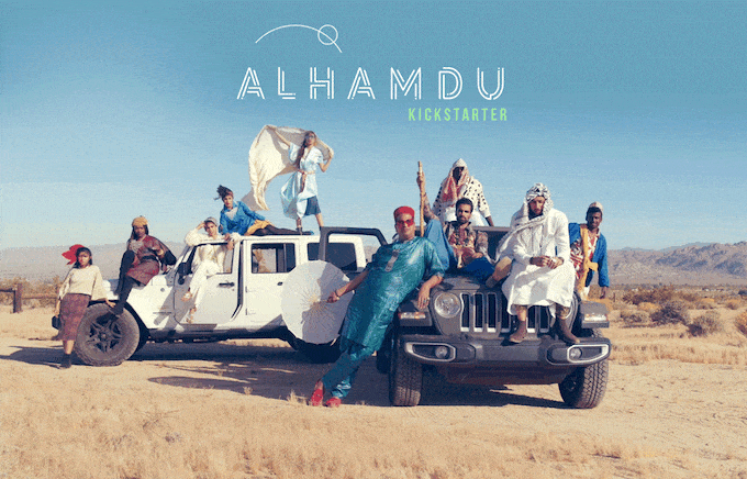 10 individuals of the Alhamdu Short Film sitting and standing on two Jeeps (one white, one gray) in the middle of a desert like area.